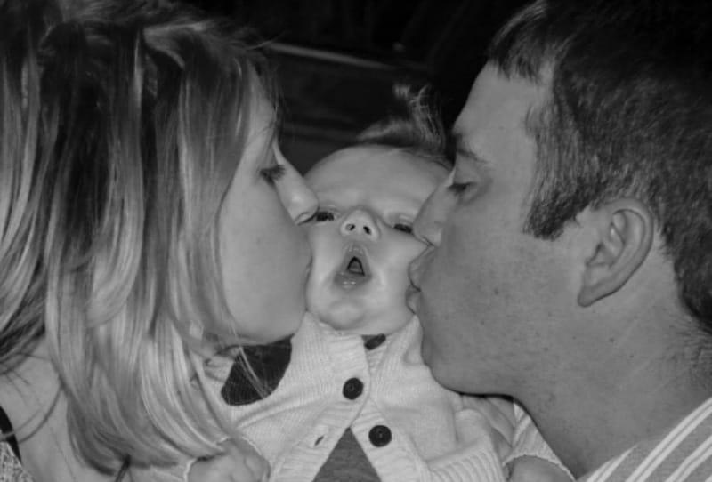 Before Jackson's second open-heart surgery, Jamie made sure to take this picture of her and Layne kissing their son. (Photo courtesy of the Dawson family)